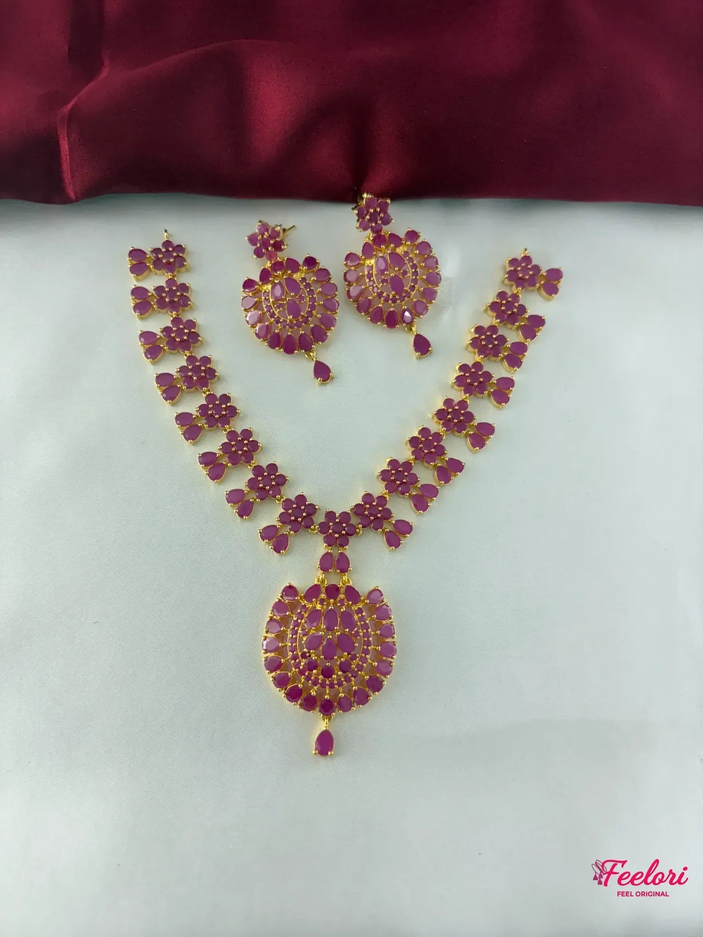 FeelOri Gold Plated Ruby Flower Bloom Necklace Set - Full front view showcasing the intricate floral arrangement and the statement pendant.
