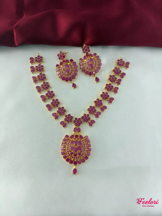 FeelOri Gold Plated Ruby Flower Bloom Necklace Set - Full front view showcasing the intricate floral arrangement and the statement pendant.