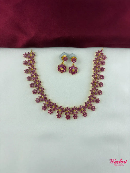 FeelOri Gold Plated Ruby Floral Necklace Earring Set - Full view displaying the intricate flower-shaped ruby stones and delicate chain.