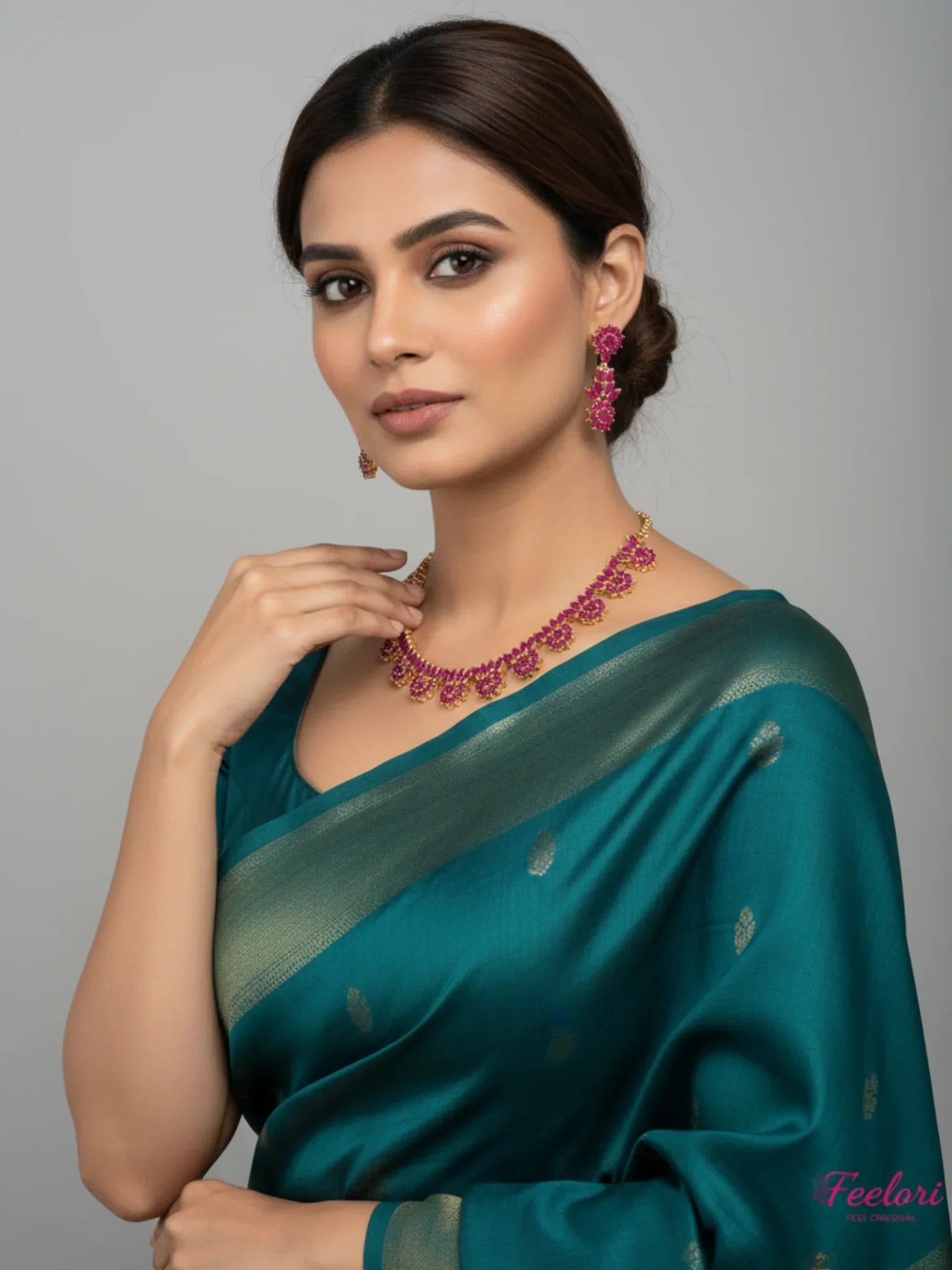 FeelOri Gold Plated Ruby Necklace Set - Model wearing elegant set with traditional saree in festive setting