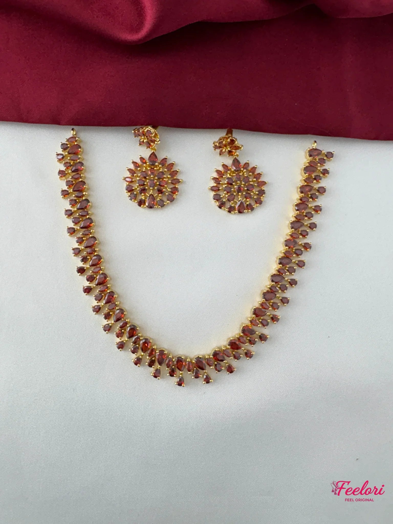 FeelOri Gold Plated Ruby Petal Cluster Necklace Set - Front view showcasing the radiant cascade design with Ruby-Tone CZ gemstones.