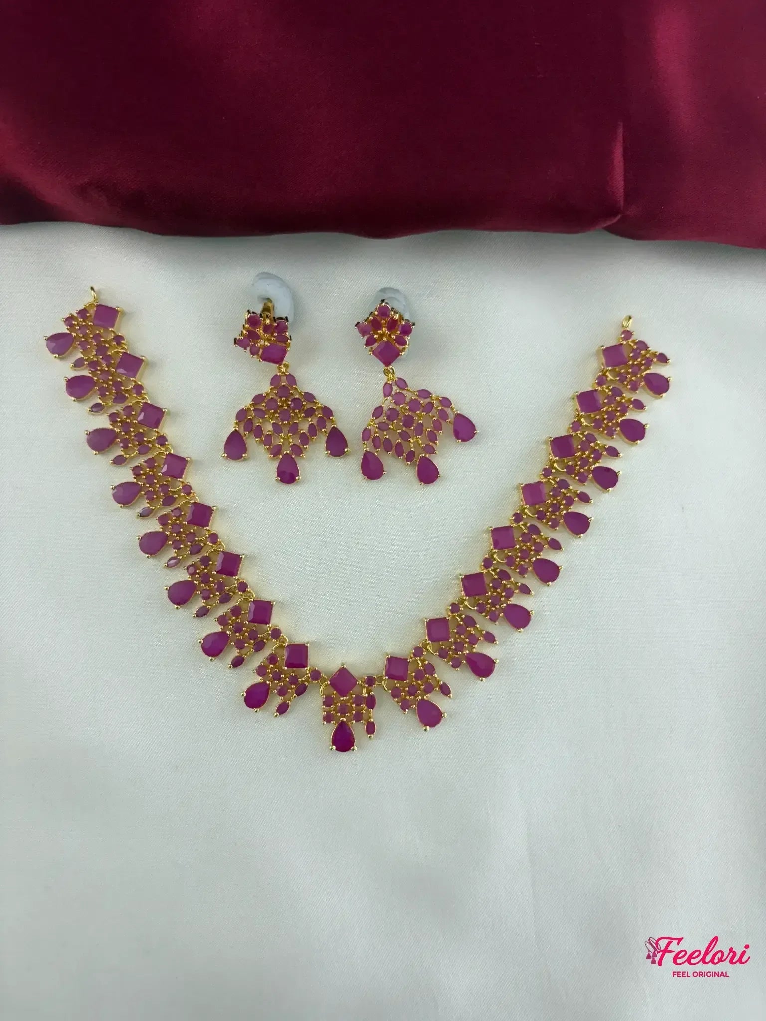 FeelOri Gold Plated Ruby Petal Cluster Necklace and Earring Set - Full view showcasing the intricate design and vibrant stones on a white background.