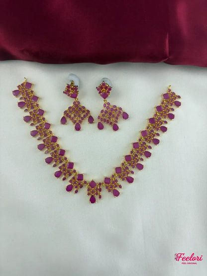 FeelOri Gold Plated Ruby Petal Cluster Necklace and Earring Set - Full view showcasing the intricate design and vibrant stones on a white background.