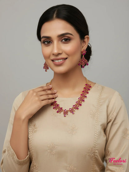 FeelOri Gold Plated Ruby Necklace Set - Model wearing elegant set with traditional beige attire.