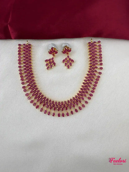 FeelOri Gold Plated Ruby Petal Necklace Set - Front view showcasing the complete set with necklace and matching earrings.