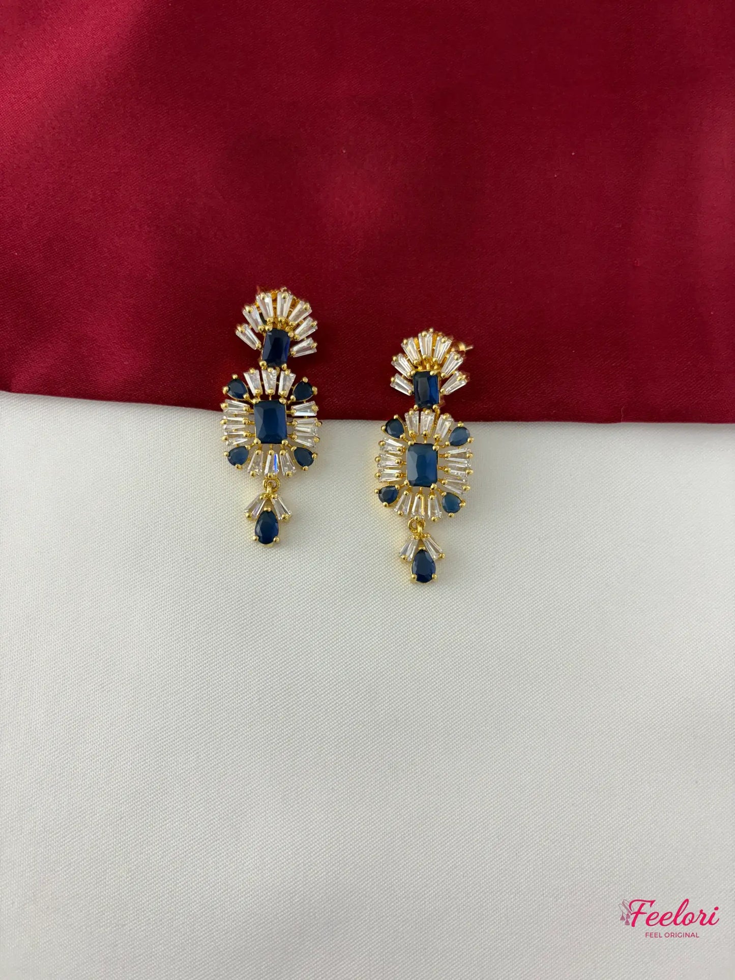 FeelOri Gold Plated Sapphire AD Earrings - Close-up view highlighting the intricate geometric pattern, brilliant AD stones, and deep blue center stones of the matching earrings.