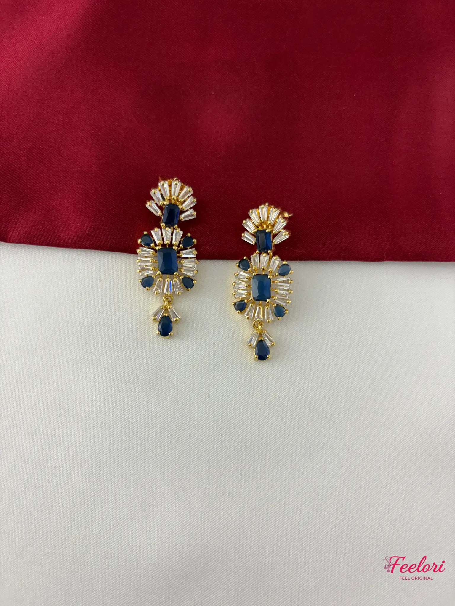 FeelOri Gold Plated Sapphire AD Earrings - Close-up view highlighting the intricate geometric pattern, brilliant AD stones, and deep blue center stones of the matching earrings.