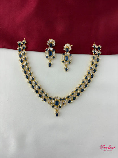 FeelOri Gold Plated Sapphire AD Necklace Set - Front view showcasing the complete set with geometric blue and white stones on a dual-toned background.