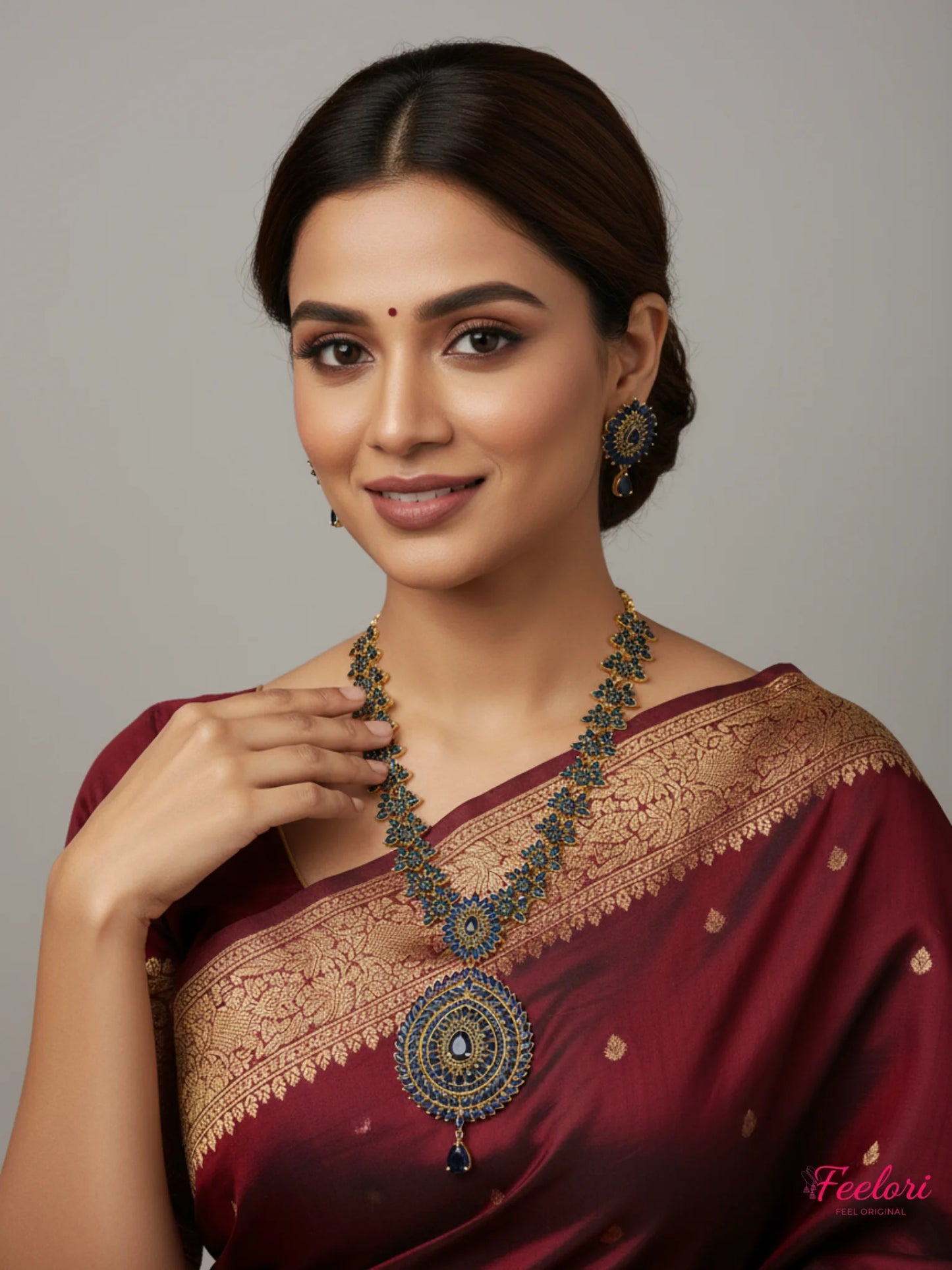 FeelOri Gold Plated Sapphire Mandala Necklace Set - Model wearing intricate set with traditional red saree.