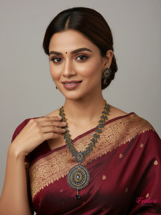FeelOri Gold Plated Sapphire Mandala Necklace Set - Model wearing intricate set with traditional red saree.