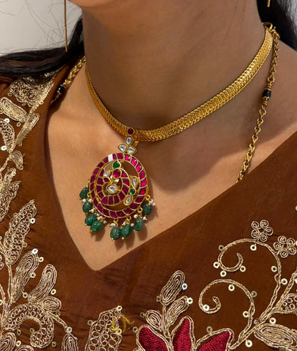 FeelOri Mayur Pathakam Peacock Pendant styled on a chain with a brown embroidered outfit; pendant only, SKU FO-RKJ-0164.