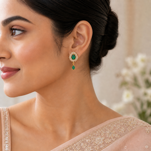 Model wearing FeelOri Minty Fresh green teardrop AD earrings with halo studs and drop detail for festive ethnic styling