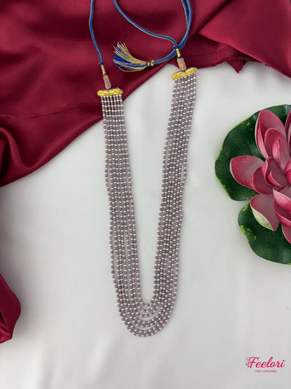 FeelOri Mother of Pearls Multi-Strand Mala - Close-up of the adjustable blue dori and gold-tone tassels with CZ stone embellishments.