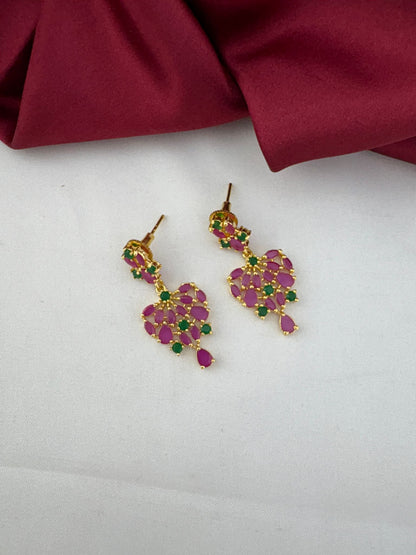 Detailed close-up of the FeelOri Mysore Vasantham ruby and emerald stone earrings, highlighting the design.