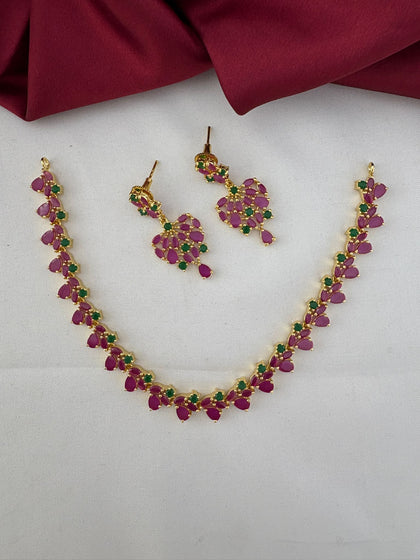 Overall layout of the FeelOri Mysore Vasantham short necklace with ruby and emerald stones, shown with matching earrings.