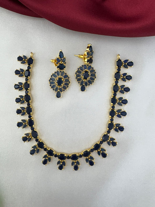 FeelOri Oceanic Serenity Blue AD Drop Short Necklace and Earrings Set displayed on a light fabric background.