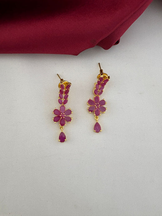 Detailed close-up of FeelOri Ruby-Tone CZ floral drop earrings from the opulent wedding necklace set.