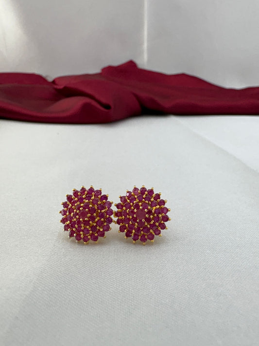 FeelOri Passionate Ruby Hue red AD stud earrings pair on white fabric highlighting rich ruby color in cluster design