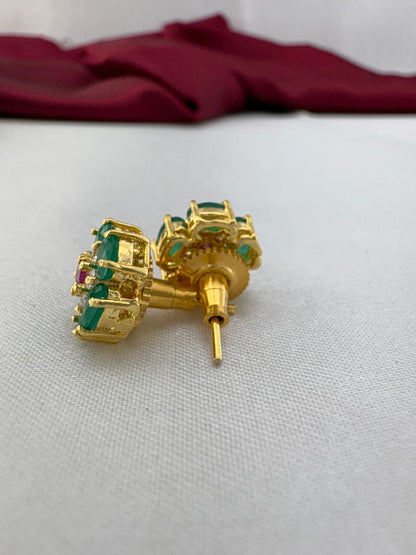FeelOri Peridot Gleam olive green AD stud earrings angled view displaying gold post construction and back mechanism
