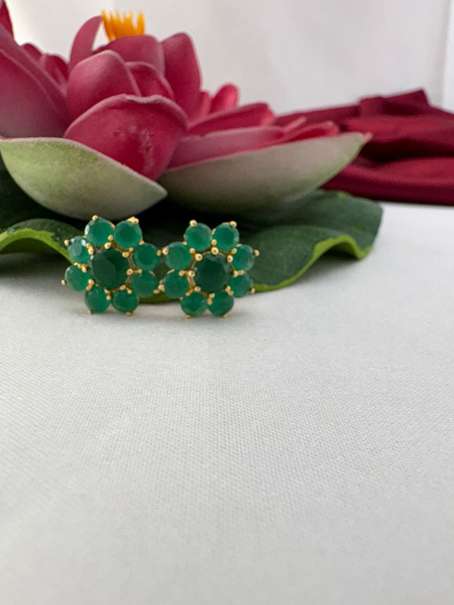 FeelOri peridot olive green AD stud earrings styled with lotus showcasing decorative jewellery stone-inspired coloring