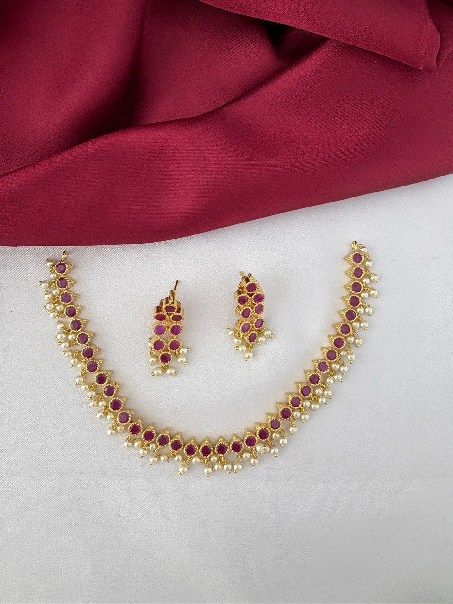 feelori Radiant Ruby-Tone CZ Short Necklace Set for Andhra Brides - Flat lay view