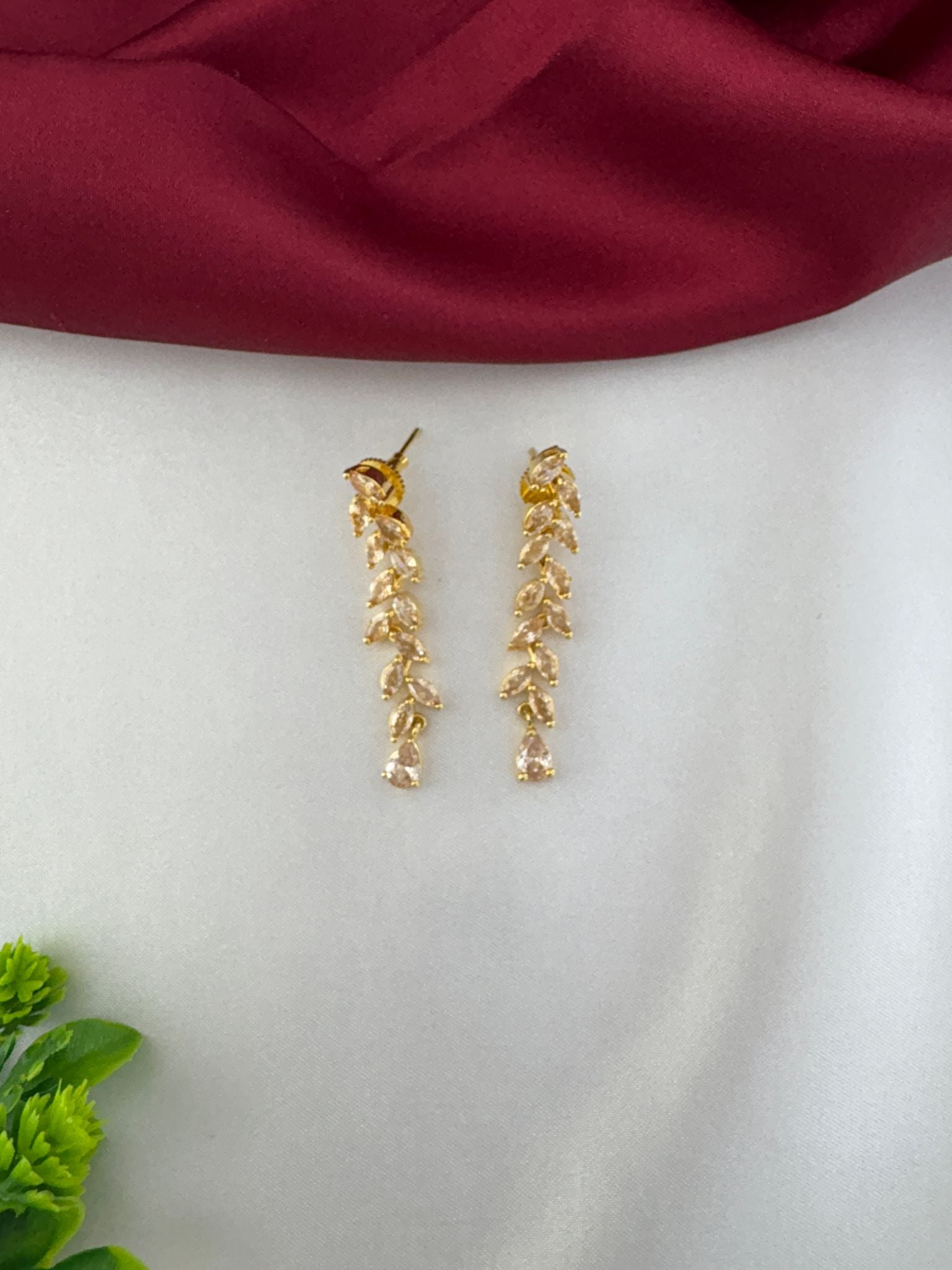 feelori Regal Gold Filigree AD Short Choker Set - Royal Touch - Detailed close-up of matching leaf design earrings