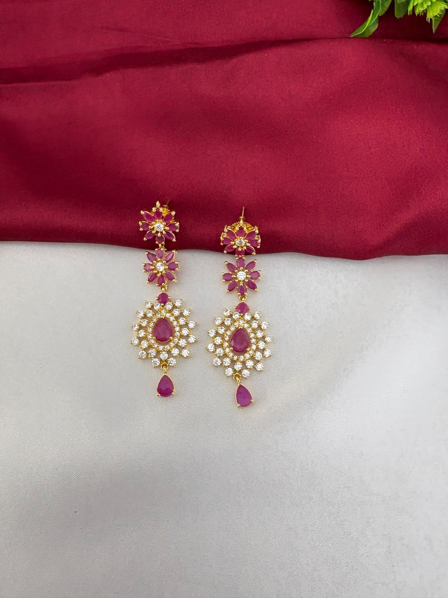 Close-up of the FeelOri Regal Ruby Bloom AD Cluster Earrings, showcasing the intricate design.