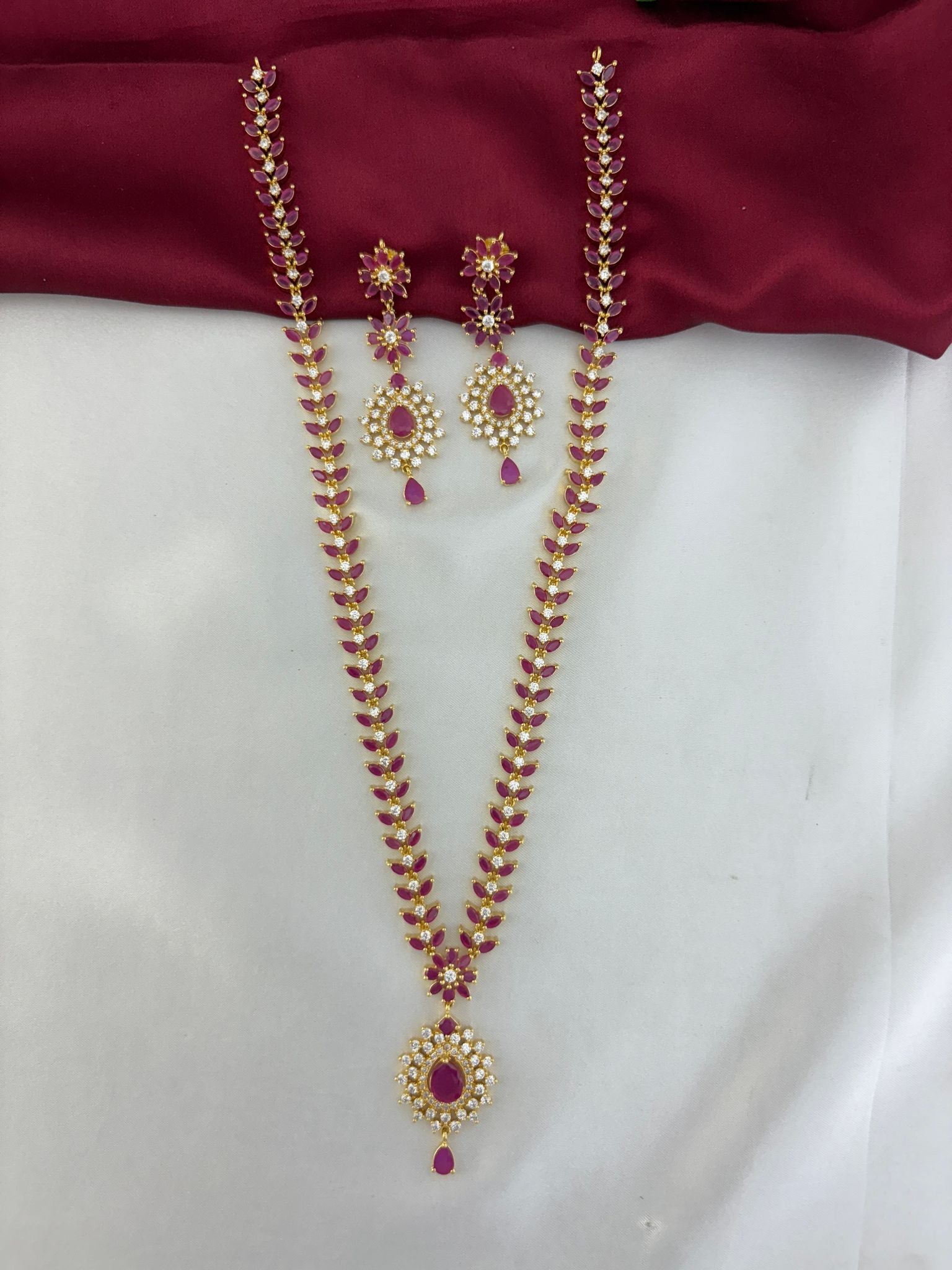 Full view of the FeelOri Regal Ruby Bloom AD Cluster Long Necklace & Earring Set.