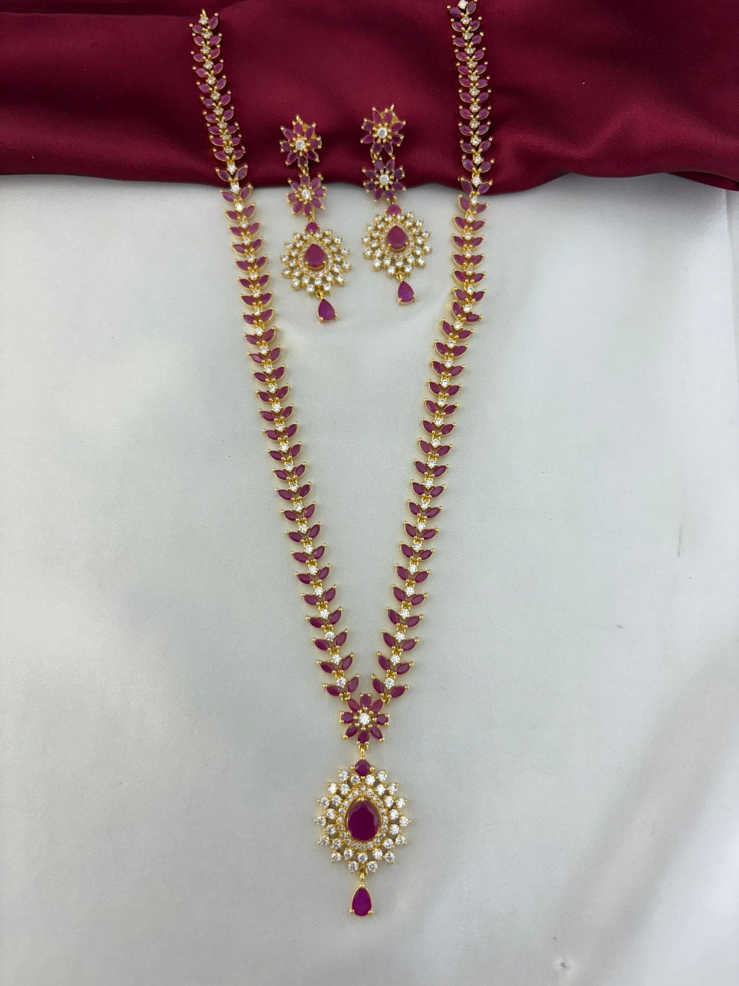 FeelOri Regal Ruby Bloom AD Cluster Long Necklace focusing on the pendant detail, with matching earrings.
