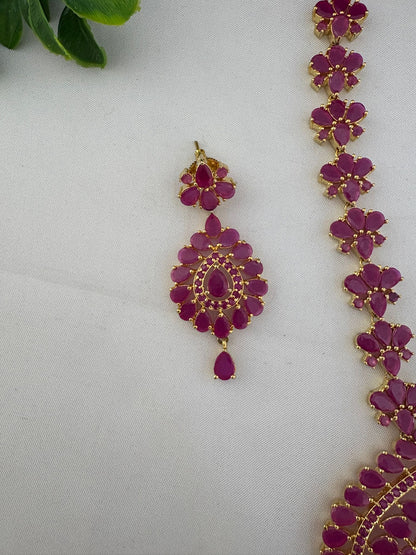 Close-up shot of an earring and necklace detail from the FeelOri Minimalist Original Ruby Short Necklace Set, highlighting the stone cuts and craftsmanship.