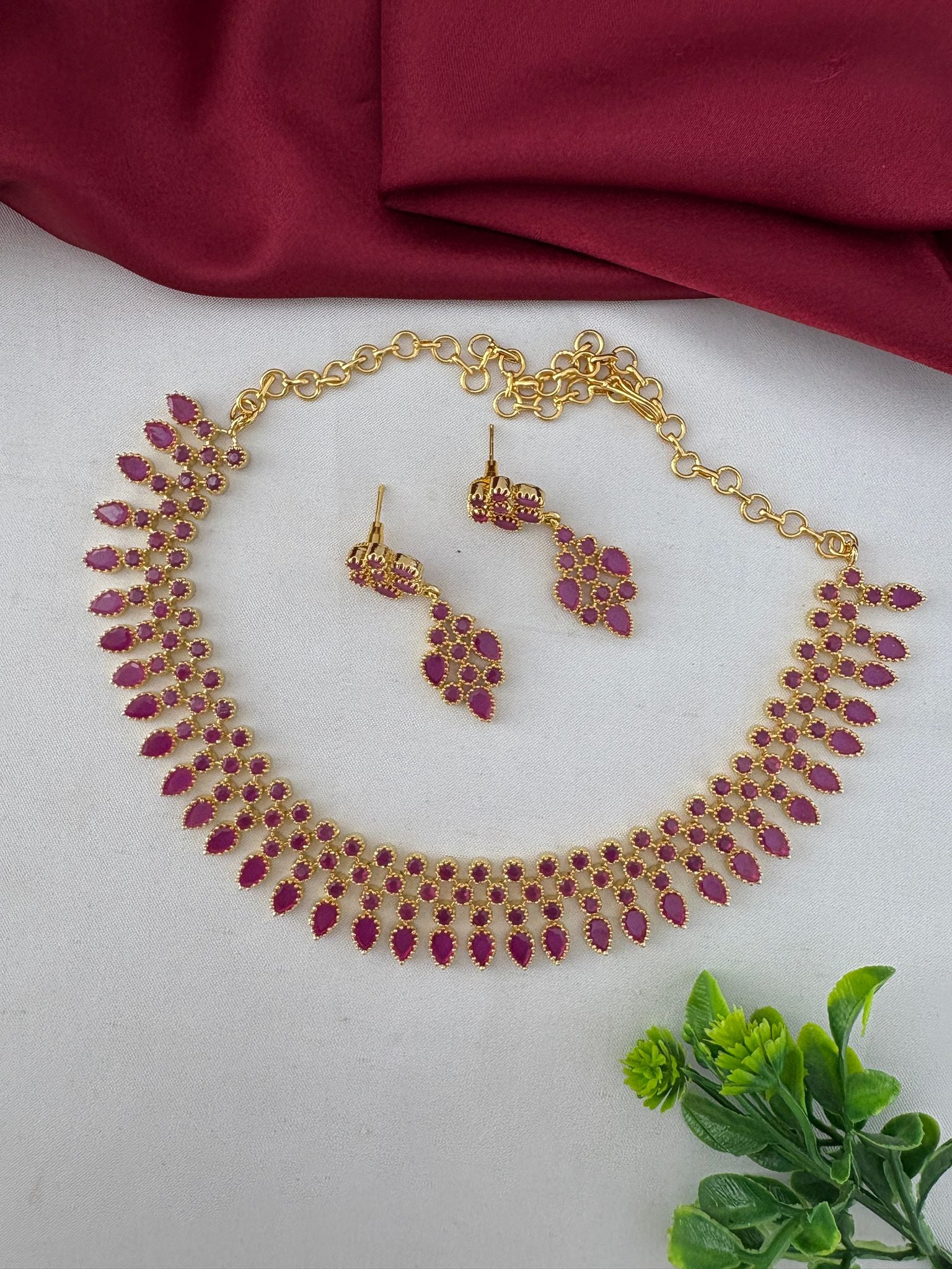 FeelOri Ruby-Tone CZ Short Necklace Set for Indian Celebrations, displayed to show the full design including earrings. Festive wear jewelry by FeelOri.