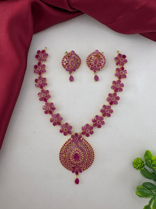 FeelOri Charming Original Ruby Short Necklace Set for Telugu Weddings, including necklace and earrings, displayed on a white and maroon background.