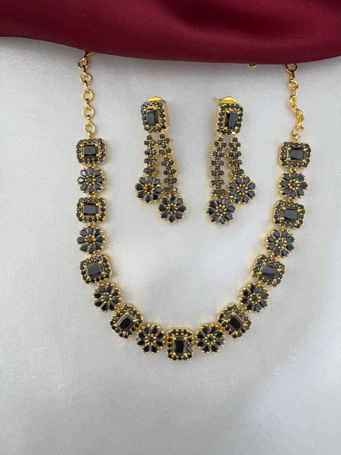 FeelOri Shadow Bloom Black AD Floral Short Necklace Set by feelori - hanging display.