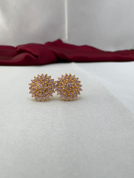 FeelOri Sweetheart baby pink AD stud earrings pair on white fabric showing delicate cluster design with gold setting