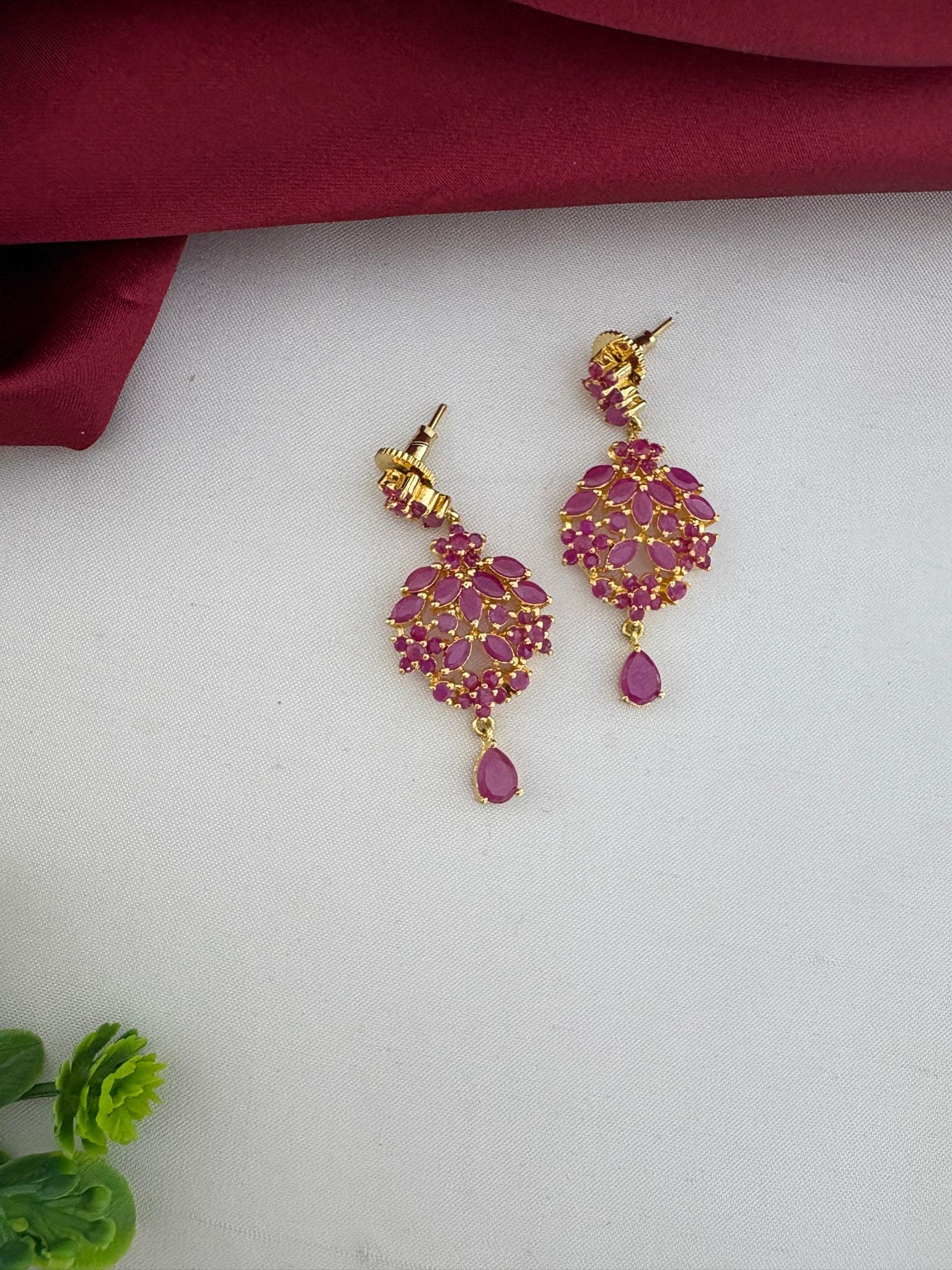 Close-up of FeelOri Temple Design Ruby-Tone CZ Earrings, highlighting the authentic craft from the short necklace set by feelori.