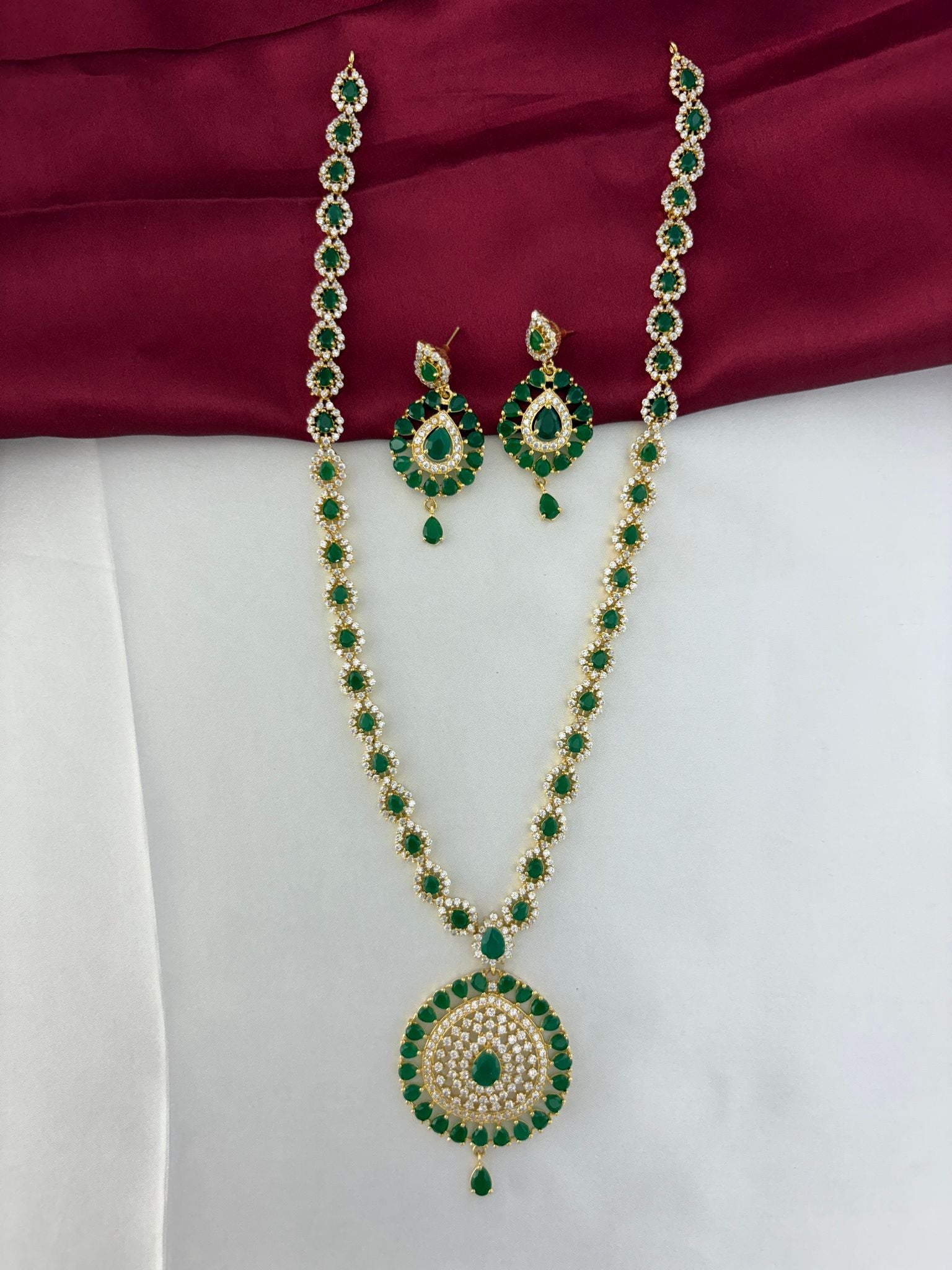 FeelOri Verdant Glade Emerald & AD Marquise Long Necklace and Earring Set - Full view on dual-tone background.