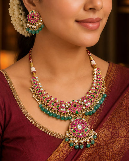 FeelOri floral panel bridal-style jadau kundan necklace set with matching earrings on jewellery display