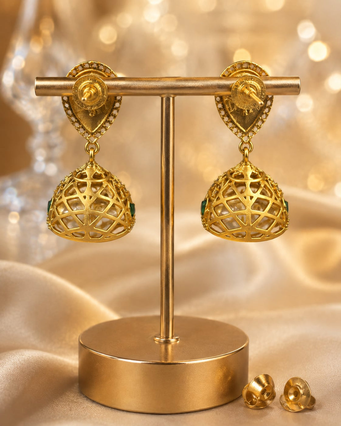 FeelOri gold-plated emerald jhumka earrings for sarees, kurtas, and festive styling