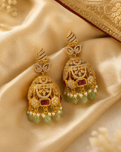 FeelOri gold-plated emerald-drop CZ leaf jhumka earrings styled with saree fabric