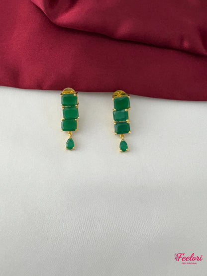 FeelOri Gold Plated Emerald Rectangle-Cut Earrings - Close-up view highlighting the stacked rectangular green stones and delicate teardrop accent.