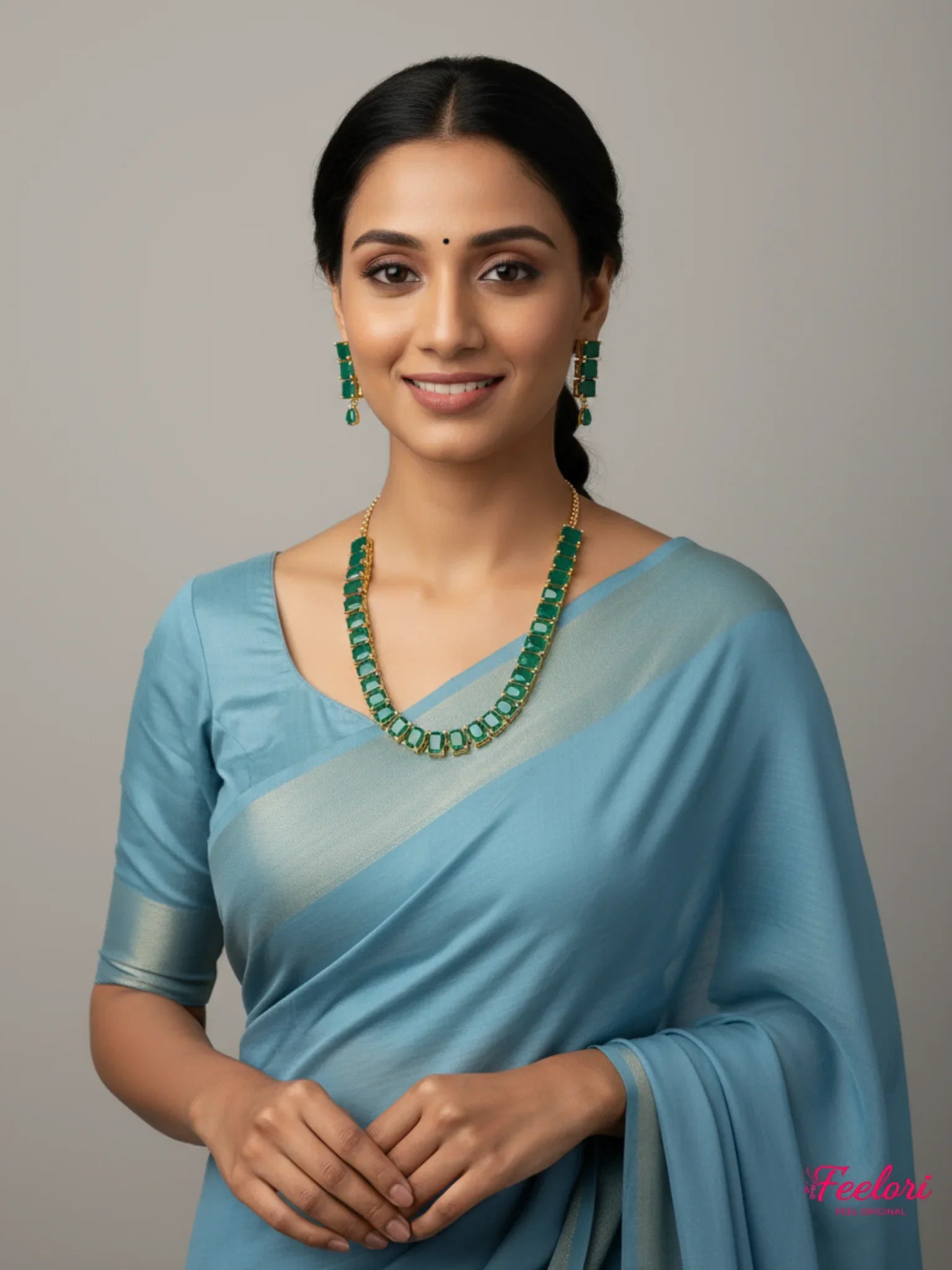 FeelOri Gold Plated Emerald Necklace Set - Model wearing elegant set with peach saree.