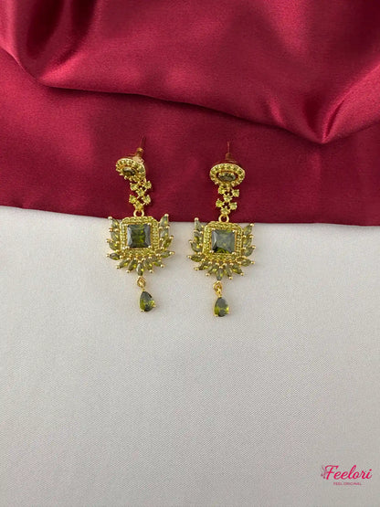 FeelOri Gold Plated Green Stone Earrings - Close-up view of the intricate earrings featuring square green stones and delicate tear-drop accents.