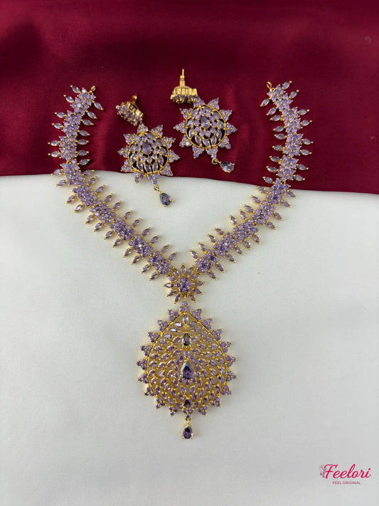 FeelOri Gold Plated Lavender Gemstone Peacock Motif Necklace Set - Full view of the necklace and matching earrings laid out.