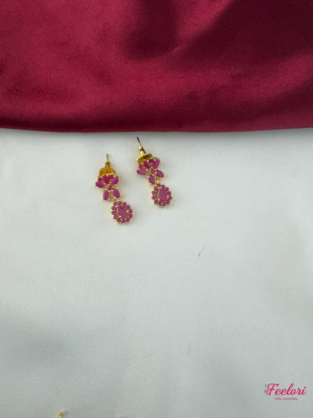 FeelOri Gold Plated Ruby Drop Earrings - Close-up view highlighting the detailed floral pattern and rich hue of the Ruby-Tone CZ-hued stones.