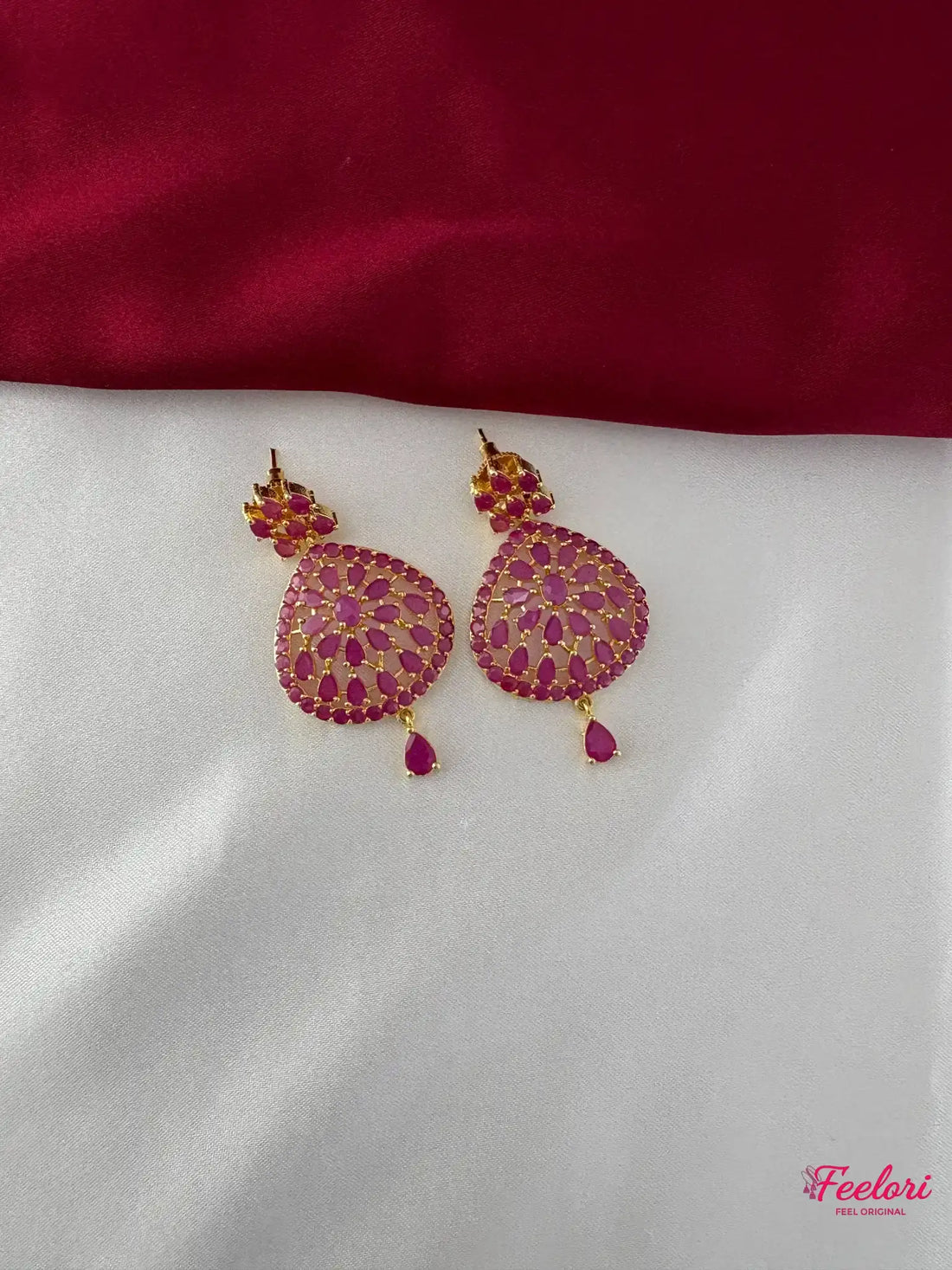 FeelOri Gold Plated Ruby Drop Earrings - Detailed view of the teardrop-shaped earrings, highlighting the Ruby-Tone CZ-hued stone arrangement and push-back clasp.