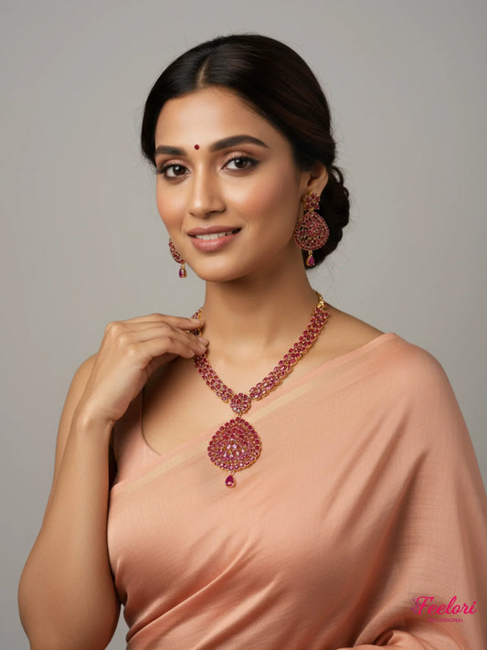 FeelOri Gold Plated Ruby Drop Necklace Set - Model wearing elegant set with traditional saree, smiling confidently.