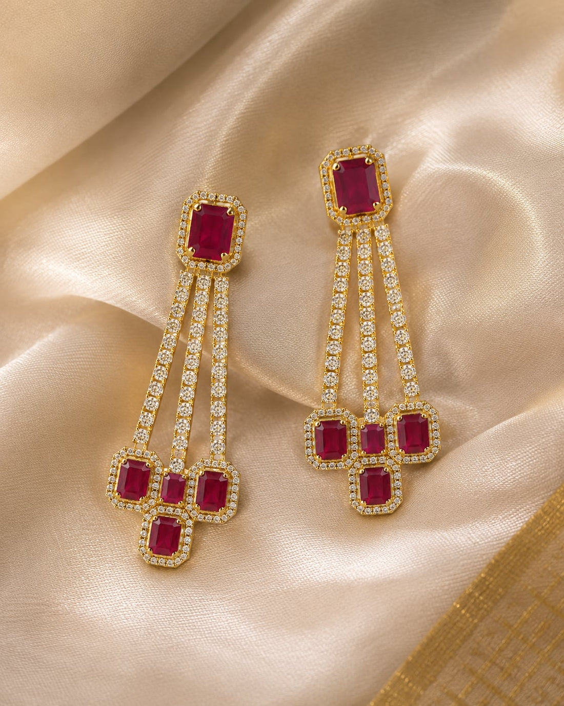 FeelOri gold-plated ruby linear CZ hanging earrings styled with saree fabric
