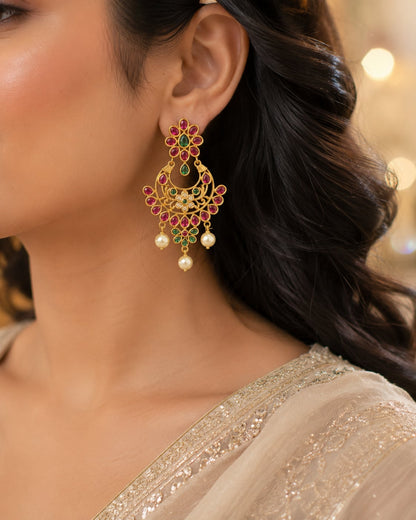 FeelOri gold-plated ruby and emerald earrings styled with saree fabric for Indian occasion wear