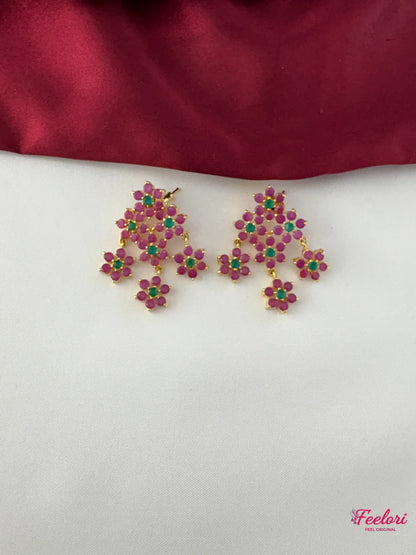 FeelOri Gold Plated Floral Ruby Emerald Earrings - Close-up view of the intricate chandelier earrings, highlighting the genuine ruby-like and emerald-like stones set in a delicate floral cluster design.