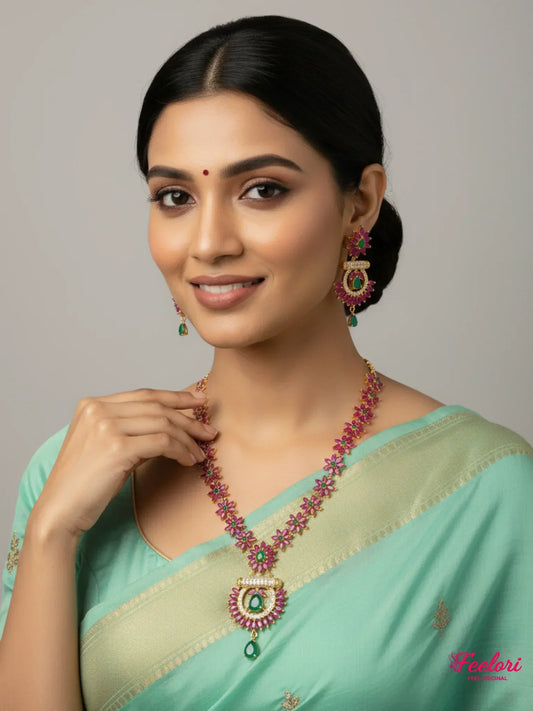 FeelOri Necklace Set - Model wearing gold plated ruby & emerald floral set with traditional green saree.